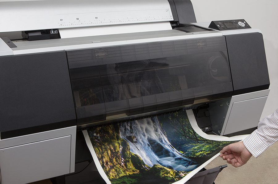 Large-format printer at H&H Custom Framing producing a fine-art landscape print