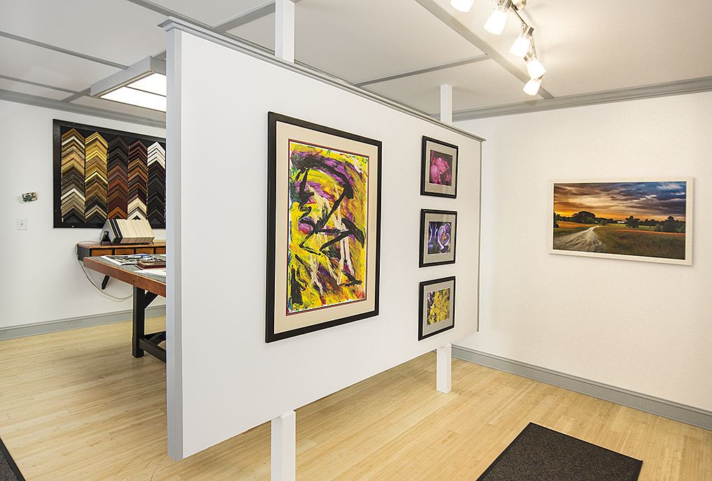 Inside H&H Custom Framing — framed artwork displayed on the shop walls